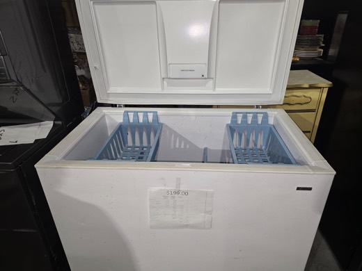 White chest freezer with storage baskets