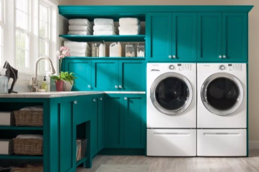 Front-load washer and dryer pair on pedestals