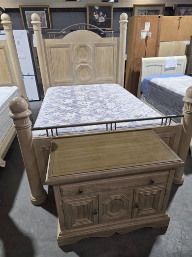 Whitewashed four-poster bed with storage chest
