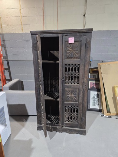 Rustic carved cabinet with iron grille doors
