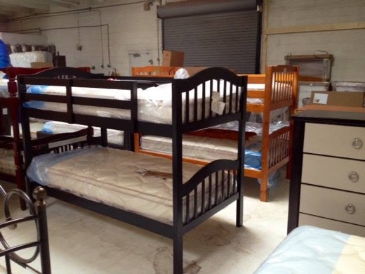 Wooden bunk beds with mattresses