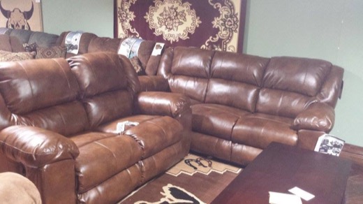 Brown leather sofa and loveseat