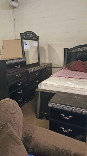 Black bedroom set with dresser and mirror