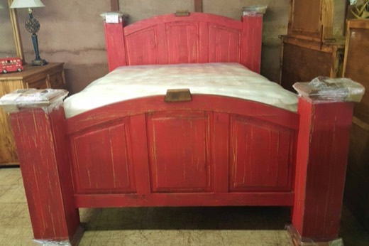 Rustic red distressed wood bed with mattress