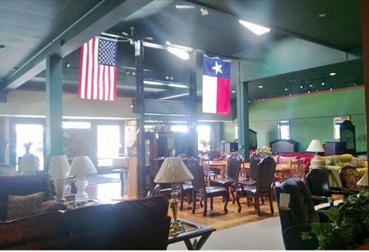 Showroom with dining sets and flags