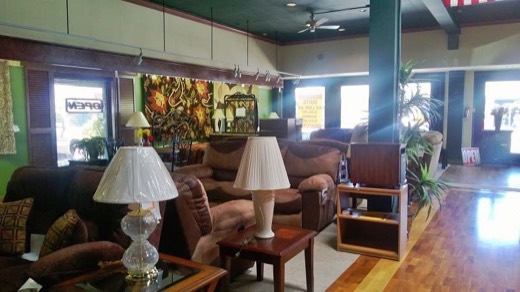 Living room showroom with sofas and lamps